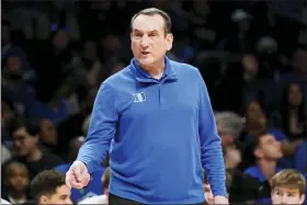  ?? JOHN MINCHILLO — THE ASSOCIATED PRESS ?? Duke head coach Mike Krzyzewski works the bench in the first half of an NCAA college basketball game against the Miami during semifinals of the Atlantic Coast Conference men’s tournament, Friday, March 11, 2022, in New York.