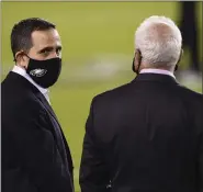  ?? THE ASSOCIATED PRESS FILE ?? Eagles general manager Howie Roseman, left, and owner Jeffrey Lurie talk before a game earlier this season.