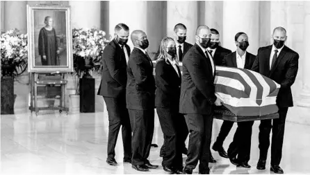  ?? ANDREW HARNIK/THE NEW YORK TIMES ?? The flag-draped casket of Ruth Bader Ginsburg is carried Wednesday into the Supreme Court. Ginsburg died Friday at 87.