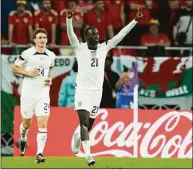  ?? Francisco Seco / Associated Press ?? Tim Weah of the United States celebrates after scoring the game’s opening goal during a World Cup group B match against Wales on Monday.