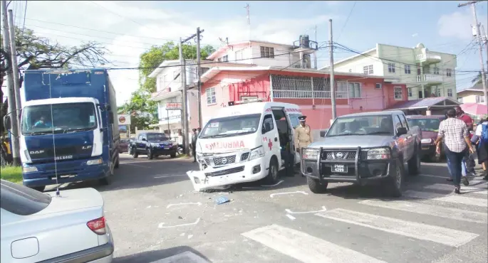  ??  ?? Ambulance in collision:This ambulance was heading east along New Market Street with its sirens on when it collided with a truck (left) which was heading north on Camp Street. Reports indicate that the truck did not yield to the ambulance.