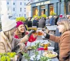  ?? Picture: Shepherd Neame ?? People had to drink outside in all weathers during the lockdown restrictio­ns