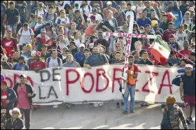  ?? ASSOCIATED PRESS ?? Migrants depart Sunday from Tapachula, Mexico. The caravan started the trek north through Mexico just days before US Secretary of State Antony Blinken arrives in Mexico City to discuss new agreements to control the surge of migrants seeking entry into the United States.