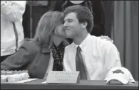  ?? NWA MEDIA/MICHAEL WOODS ?? Fayettevil­le quarterbac­k Austin Allen gets a hug and kiss from his mother, Marcella, after signing his letter of intent to play at Arkansas next fall during a ceremony at Fayettevil­le High School on Wednesday. Two of his teammates, Alex Brignoni and...