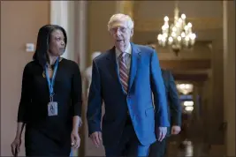  ?? J. SCOTT APPLEWHITE — THE ASSOCIATED PRESS ?? Days away from a default crisis, Senate Minority Leader Mitch McConnell, R-Ky., walks to the chamber at the Capitol in Washington on Thursday.