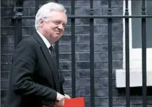  ?? Daniel Leal-Olivas/AFP/Getty Images ?? David Davis, then-Britain's Brexit minister, leaving 10 Downing St. in central London last month after attending the weekly Cabinet meeting.