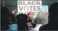  ?? Matthew Brown / Hearst Connecticu­t Media ?? Stamford native Cordale Booker speaks to hundreds gathered in front of the Stamford Government Center as they hold a Black Votes Matter Rally on Saturday in Stamford.