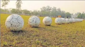  ?? HT PHOTO ?? A file photo showing footballs lined up before students’ training session at GGS Sports College in ▪
Lucknow.