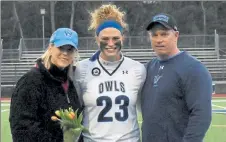  ?? COURTESY OF WESTFIELD STATE ATHLETICS ?? Westfield State’s Sam Donohoe with her parents Erica and Tim during the team’s 2021 Senior Day ceremony.