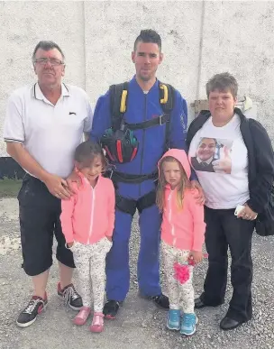  ??  ?? David Price with his family at the skydive