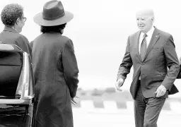  ?? AP ?? President Joe Biden greets Los Angeles Mayor Karen Bass (left) and Maxine Waters, D-California., as he arrives at Los Angeles Internatio­nal Airport on Tuesday.