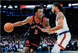  ?? Frank Franklin II / Associated Press ?? Toronto’s OG Anunoby is defended by New York's Derrick Rose on Monday. Anunoby had a career-high 36 points in the win.