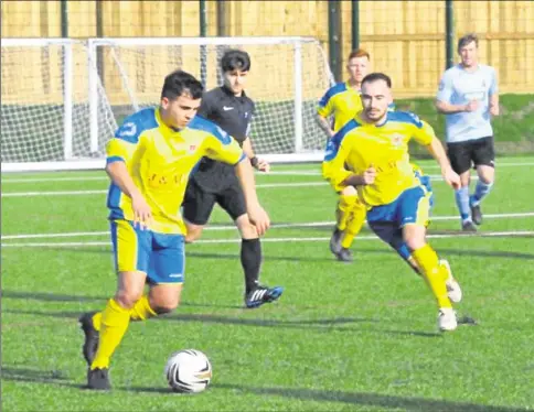  ??  ?? Tenterden Town move the ball out against Mackland Arms on Saturday