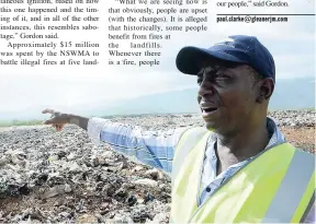  ?? NORMAN GRINDLEY/CHIEF PHOTO EDITOR ?? Audley Gordon, National Solid Waste Management Authority executive director, points to a section of the Riverton landfill after a fire that was put out at the dump.