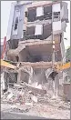  ?? PTI ?? Workers use bulldozers to demolish an illegal building in Kanpur on Saturday.