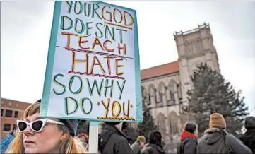  ?? JOHN MINCHILLO/AP ?? Protesters in Covington, Kentucky, gather in 2019 after a video circulated of white students and a Native American man.