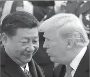  ?? AP Photo/Andy Wong, File ?? Ceremony: In this Nov. 9, 2017, file photo, U.S. President Donald Trump, right, chats with Chinese President Xi Jinping during a welcome ceremony at the Great Hall of the People in Beijing. The White House’s move to expand Washington’s dispute with Beijing beyond trade and technology and into accusation­s of political meddling have sunk relations between the world’s two largest economies to their lowest level since the end of the Cold War.