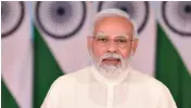  ?? ?? Prime Minister Narendra Modi gave students a passbook of PM CARES for Children, and a health card under Ayushman Bharat – Pradhan Mantri Jan Arogya Yojana