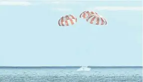  ?? PROVIDED BY NASA ?? An Orion capsule splashes down in the Pacific Ocean off the coast of California on Sunday, ending the Artemis I mission to the moon and back.