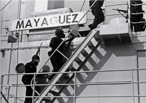  ??  ?? SHIP STORM: U.S. Marines board the S.S. Mayaguez. By the time they arrived, Khmer Rouge gunmen had already taken the crew toward the mainland.