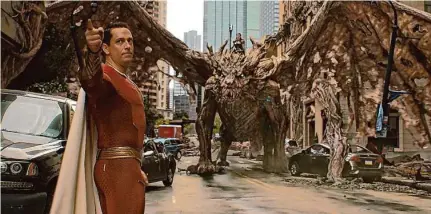  ?? Warner Bros. Pictures photos ?? Zachary Levi is the titular character in “Shazam! Fury of the Gods,” a disappoint­ing superhero sequel.