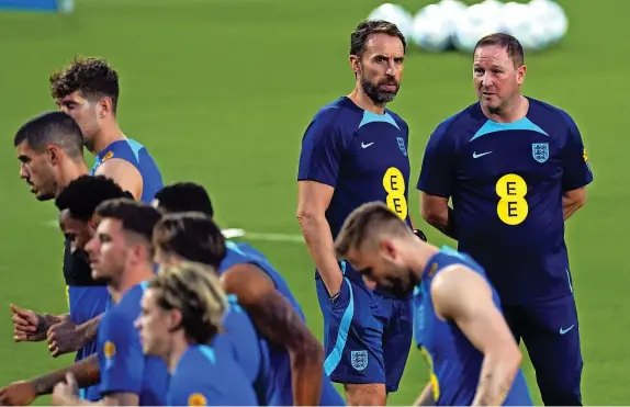  ?? Picture: Nick Potts/PA ?? THURSDAY, NOVEMBER 17, 2022
England manager Gareth Southgate alongside assistant Steve Holland during yesterday’s training session at the Al Wakrah Sports Club