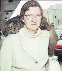  ?? GUARDIAN PHOTO ?? Betty Ann Wood, also known as the Cat Lady, is shown with Donnelly, her late Maine Coon cat, in a 2002 file photo. The Charlottet­own woman has regained consciousn­ess after three days in a coma at the Moncton Hospital. She is expected to return to the...