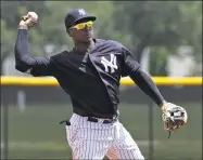  ?? Chris O’Meara / Associated Press ?? Didi Gregorius throws to first during a Gulf Coast League game on Monday in Tampa, Fla.