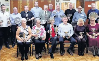  ??  ?? Northfield The winners of the annual prize- giving line- up with the trophies Gents: championsh­ip: Graham McKinley, r- up: Stevie Longair; Pres & Vice Pres: Colin Smith, r- up: Brian Fulton; McDonald Agnew: Graham Arnott, r- up: Graham Longair;...