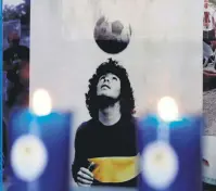  ??  ?? Detail of an altar dedicated to former Argentine football legend Diego Armando Maradona, Puebla, Mexico, July 7, 2021.