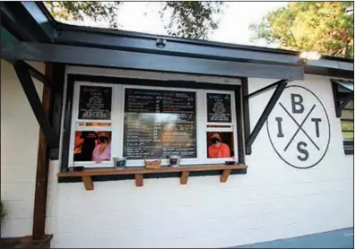  ?? (AP/Hannah Albert) ?? Workers at Braised in the South restaurant on Johns Island, S.C., wait on customers in September. The business is having trouble finding workers during the pandemic.