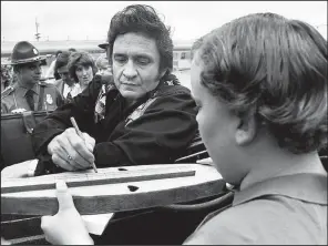  ?? Democrat-Gazette file photo ?? Even after he became an internatio­nal superstar, Johnny Cash often returned to his home state, such as in this 1976 visit.