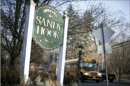  ?? JESSICA HILL — THE ASSOCIATED PRESS, FILE ?? In Newtown, Conn., 26people were killed by a gunman inside Sandy Hook Elementary School. Students who were planning to attack schools showed troubled histories, according to a U.S. Secret Service study released Tuesday.