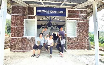  ??  ?? Residents of Batang Ai rejoice at the setting up of a community library built near Rumah Nanga Ukom.