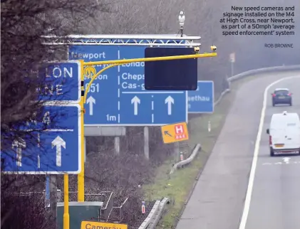  ?? ROB BROWNE ?? New speed cameras and signage installed on the M4 at High Cross, near Newport, as part of a 50mph ‘average speed enforcemen­t’ system