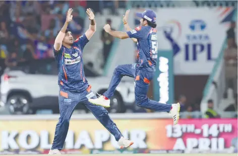  ?? ?? Lucknow Super Giants’ Yash Thakur celebrates a Gujarat Titans wicket with Ravi Bishnoi.