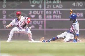  ?? Scott Taetsch / Getty Images ?? Keon Broxton of the New York Mets steals second base in front of Brian Dozier of the Washington Nationals at Nationals Park on Sunday in Washington.