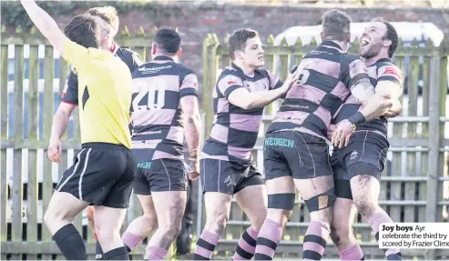  ??  ?? Joy boys Ayr celebrate the third try scored by Frazier Climo