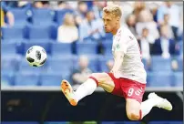  ??  ?? Denmark’s forward Nicolai Jorgensen jumps to bring under control a long ball into the box during the Russia 2018 World Cup Group C football match between Denmark and Australia at the Samara Arena
in Samara on June 21. (AFP)