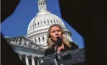  ?? Drew Angerer / Getty Images ?? Rep. Marjorie Taylor Greene, R-Ga., addresses reporters outside the U.S. Capitol on Friday.