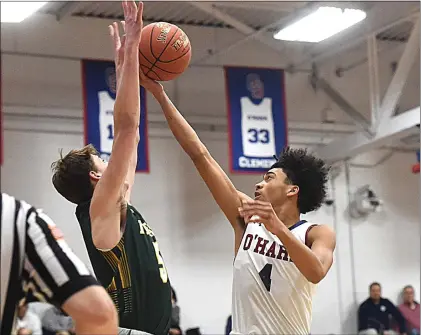  ?? PETE BANNAN - MEDIANEWS GROUP ?? Cardinal O’Hara’s Izaiah Pasha, right, puts a shot up in the first half against Bonner & Prendie’s Brady Egan in Catholic League playoffs last season.