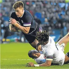 ??  ?? Huw Jones crashes over for Scotland’s third try.