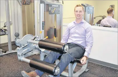  ?? ERIC MCCARTHY/JOURNAL PIONEER ?? Geoffrey Irving, marketing and events co-ordinator for the Mill River Resort, demonstrat­es equipment in the resort’s new fitness facility. The fitness room, conference centre, pro shop and sports lounge on the resort’s lower level have all been...