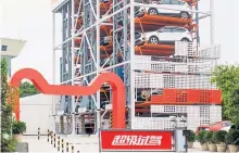  ?? Reuters ?? Ford-„Auto-Mat“von Alibaba in Guangzhou, China: Online bestellen und bezahlen, dann abholen.