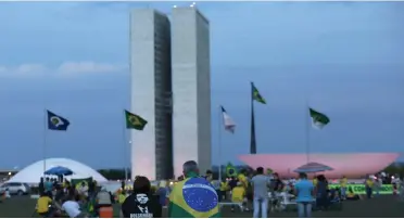  ??  ?? AP/ ERALDO PERES Supporters of Jair Bolsonaro rally in front of the headquarte­rs of the national Congress in Brasilia.