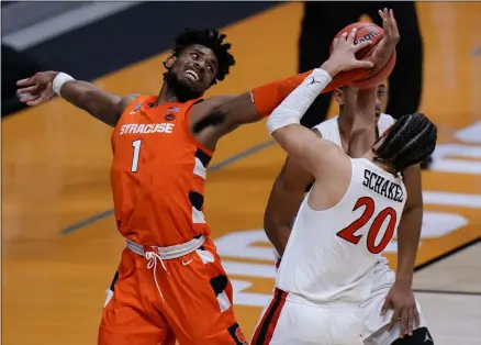  ?? AJ MAST - THE ASSOCIATED PRESS ?? Syracuse forward Quincy Guerrier (1) fights for a rebound with San Diego State guard Jordan Schakel (20) during the first half of a college basketball game in the first round of the NCAA tournament at Hinkle Fieldhouse in Indianapol­is, Friday, March 19, 2021.