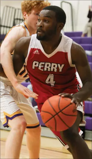  ?? DAVID TURBEN — FOR THE NEWS-HERALD ?? Perry’s Jaylen Anderson drives against Berkshire on Dec. 11, 2020.