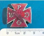  ??  ?? Badge from a wartime organisati­on. See above for details.