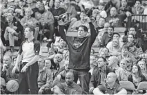  ?? LM OTERO/AP ?? Dallas Mavericks owner Mark Cuban (center) is putting up $75,000 for a 30 percent stake in MistoBox, a Phoenix coffee company.