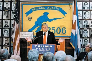  ?? AL DIAZ/MIAMI HERALD 2016 ?? President Donald Trump, seen as a candidate visiting the Bay of Pigs Museum in Miami’s Little Havana, would likely revert to pre-President Barack Obama restrictio­ns on travel by Americans to Cuba and on trade and commerce by U.S. firms.